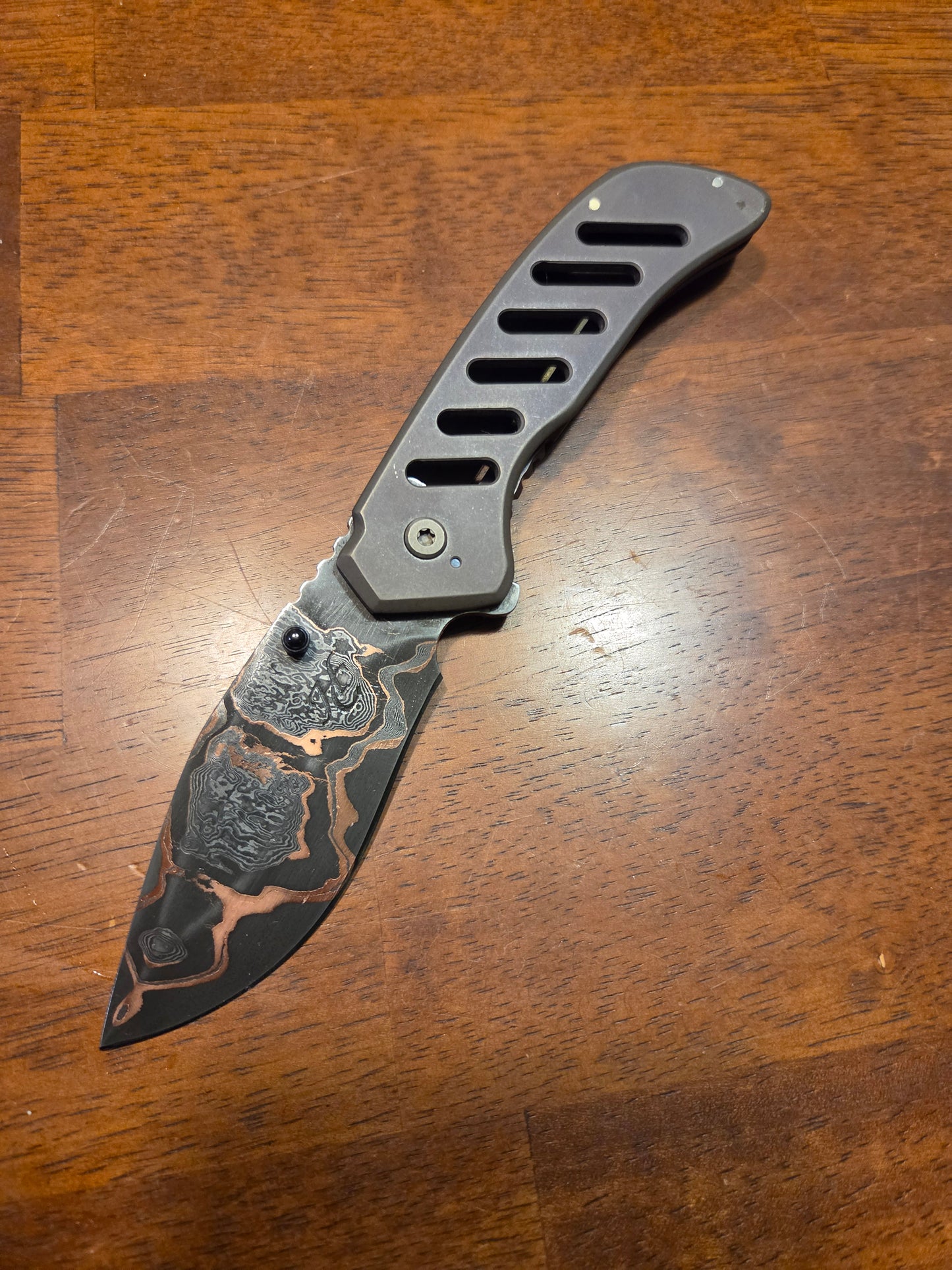 Titanium frame lock