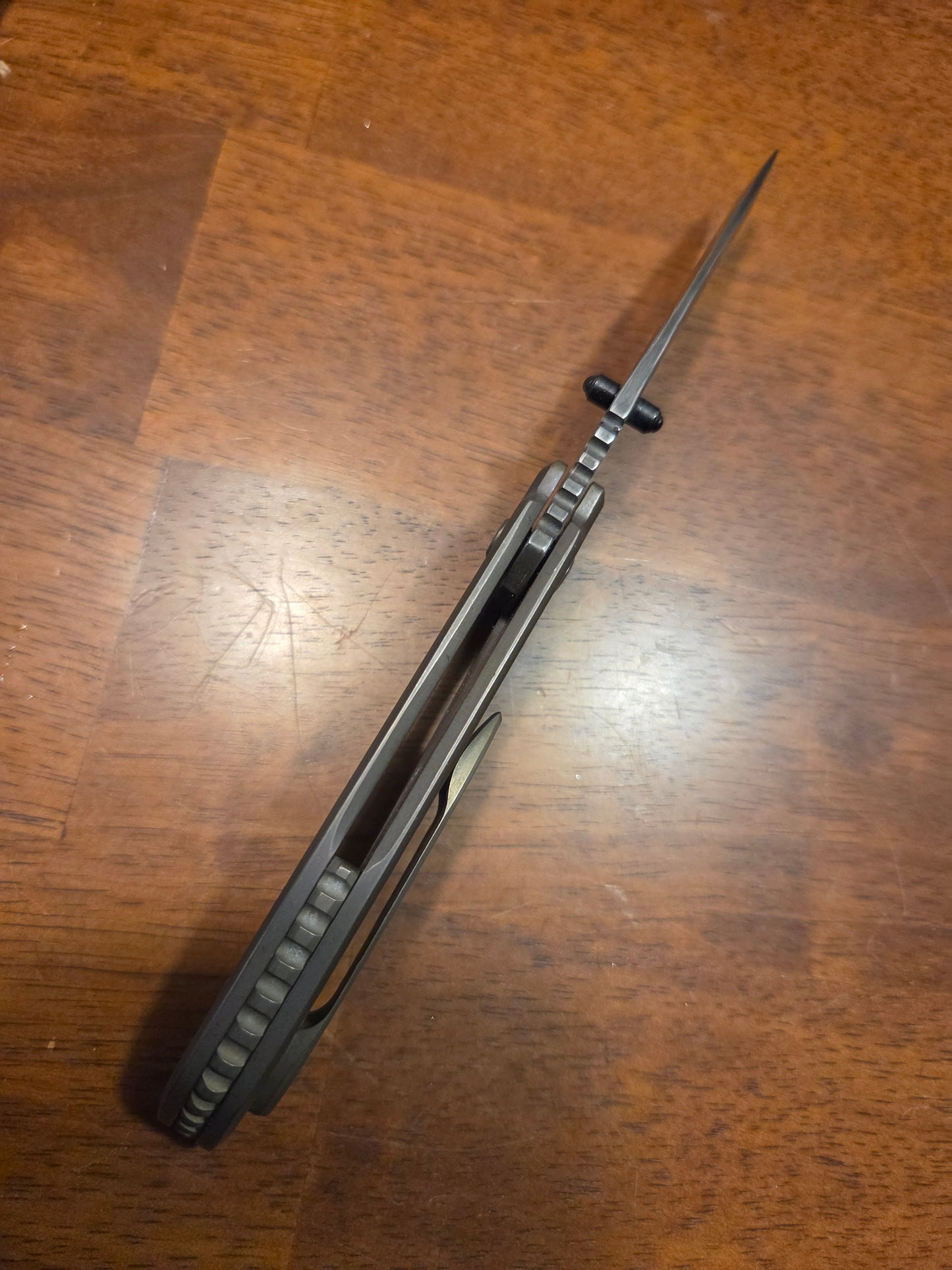 Titanium frame lock