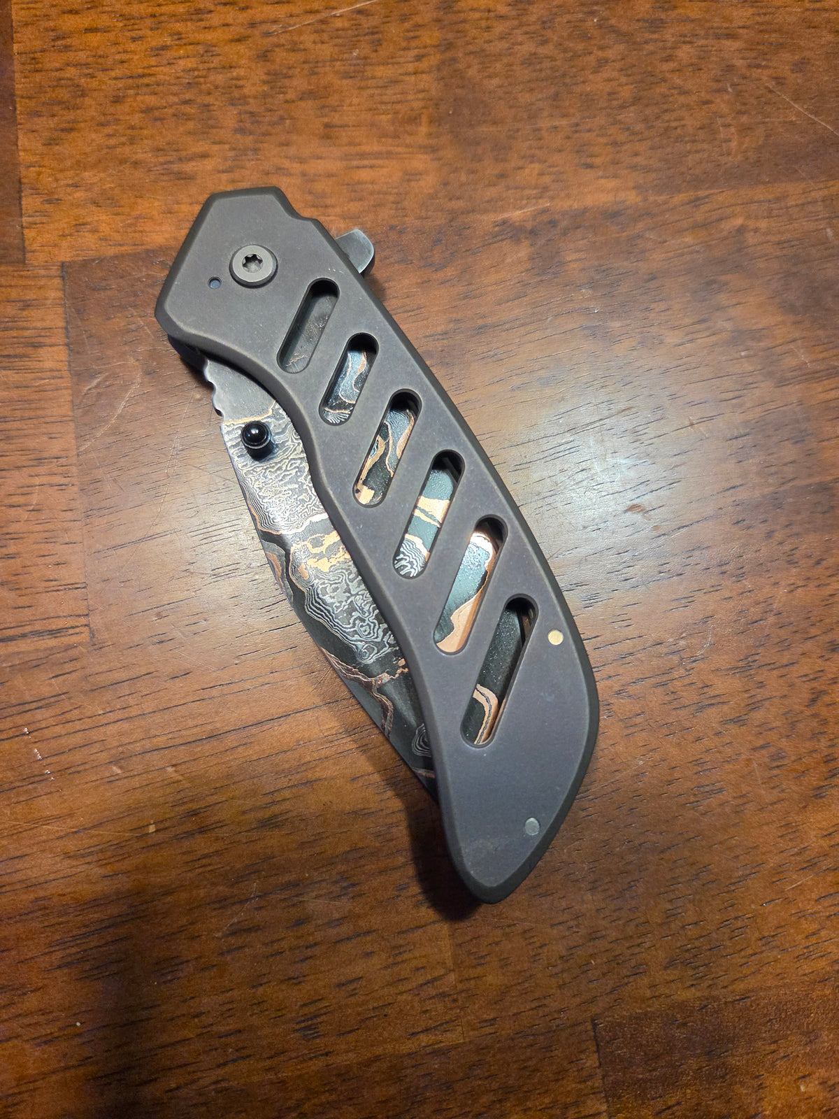 Titanium frame lock