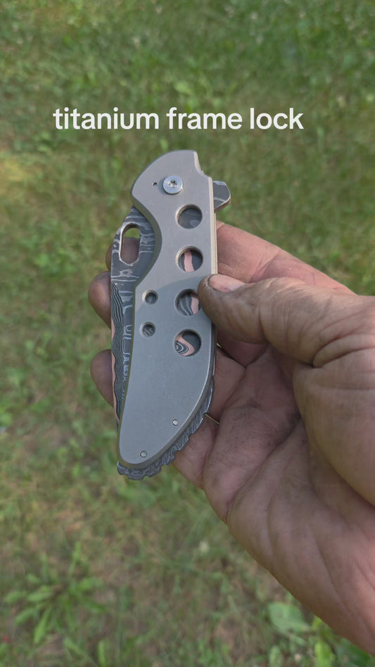 Copper Damascus titanium frame lock.