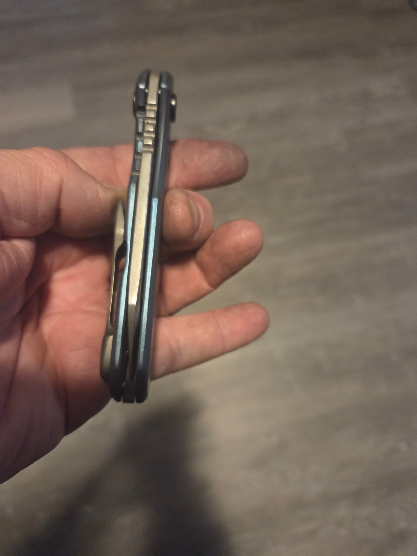 Blue anodized titanium frame lock