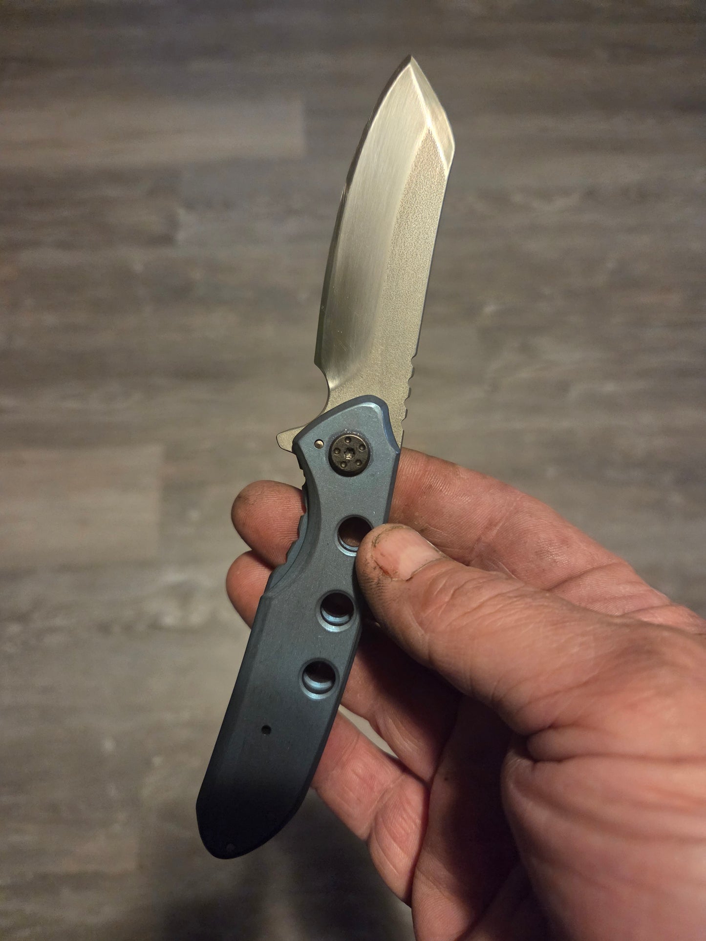 Blue anodized titanium frame lock