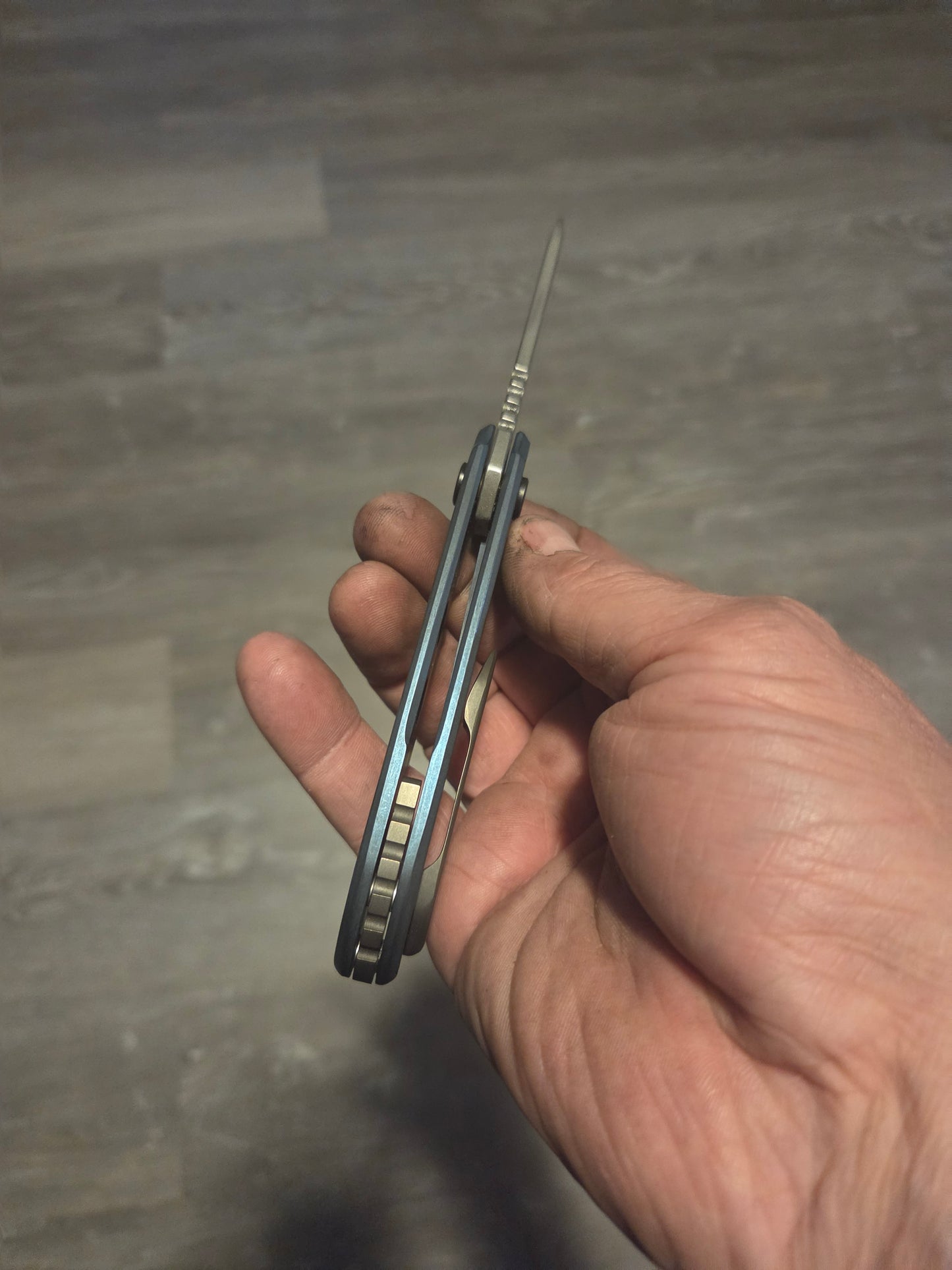 Blue anodized titanium frame lock