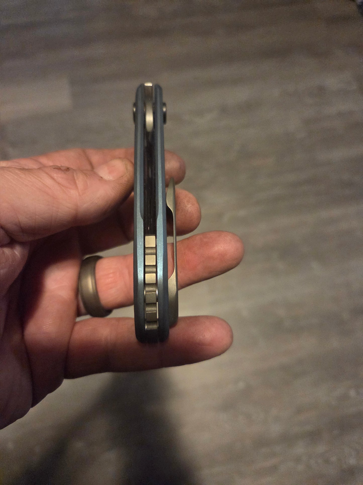 Blue anodized titanium frame lock