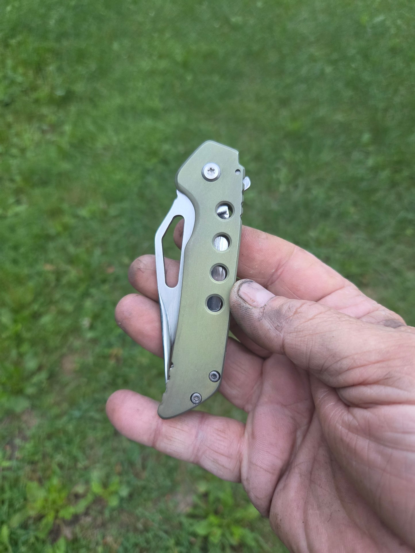 Green titanium frame lock
