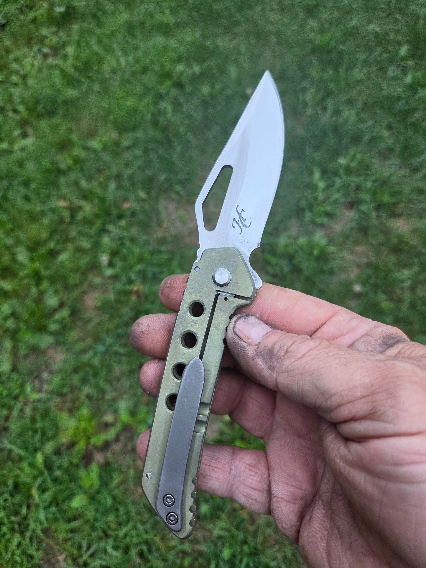 Green titanium frame lock