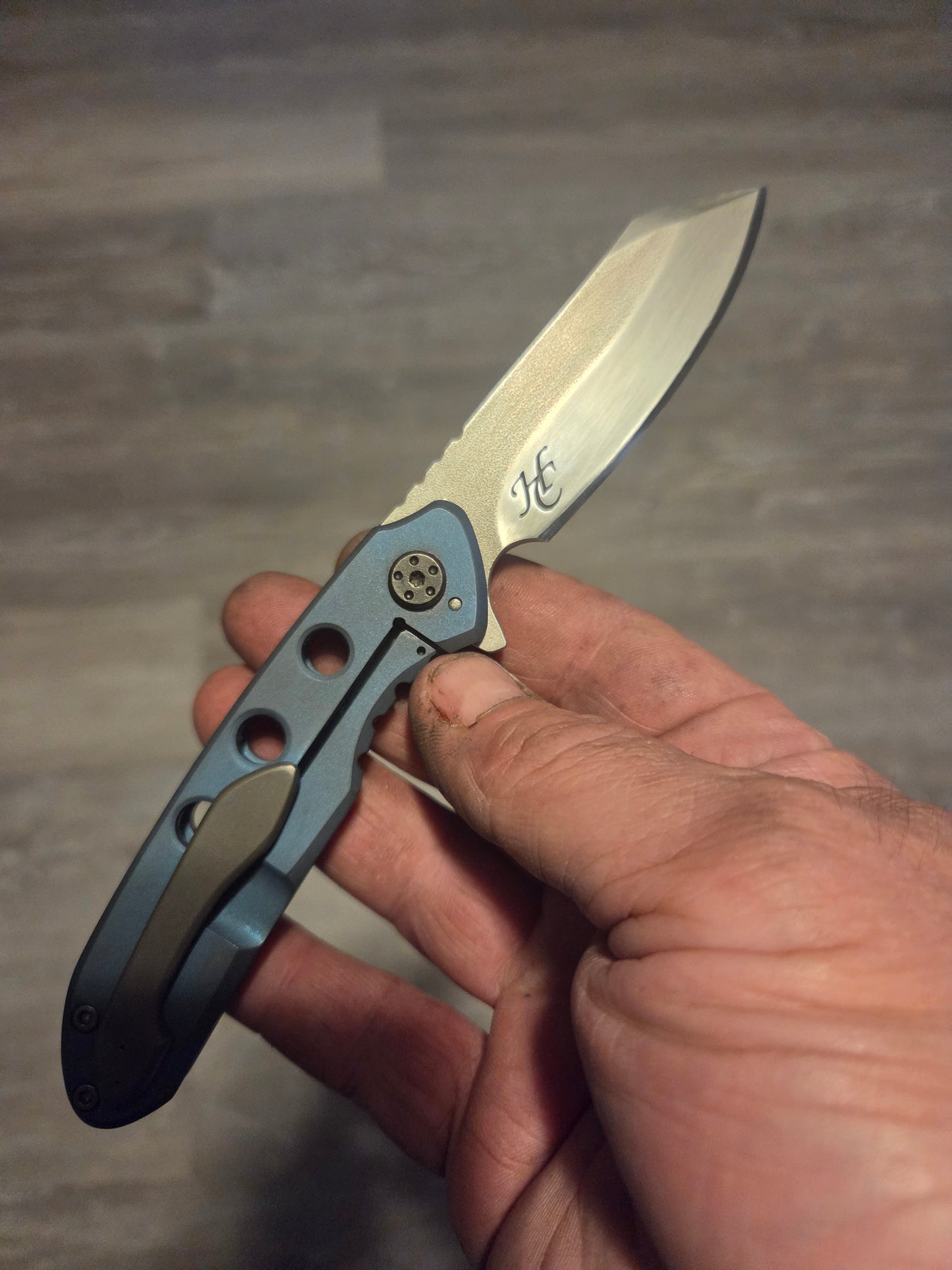 Blue anodized titanium frame lock