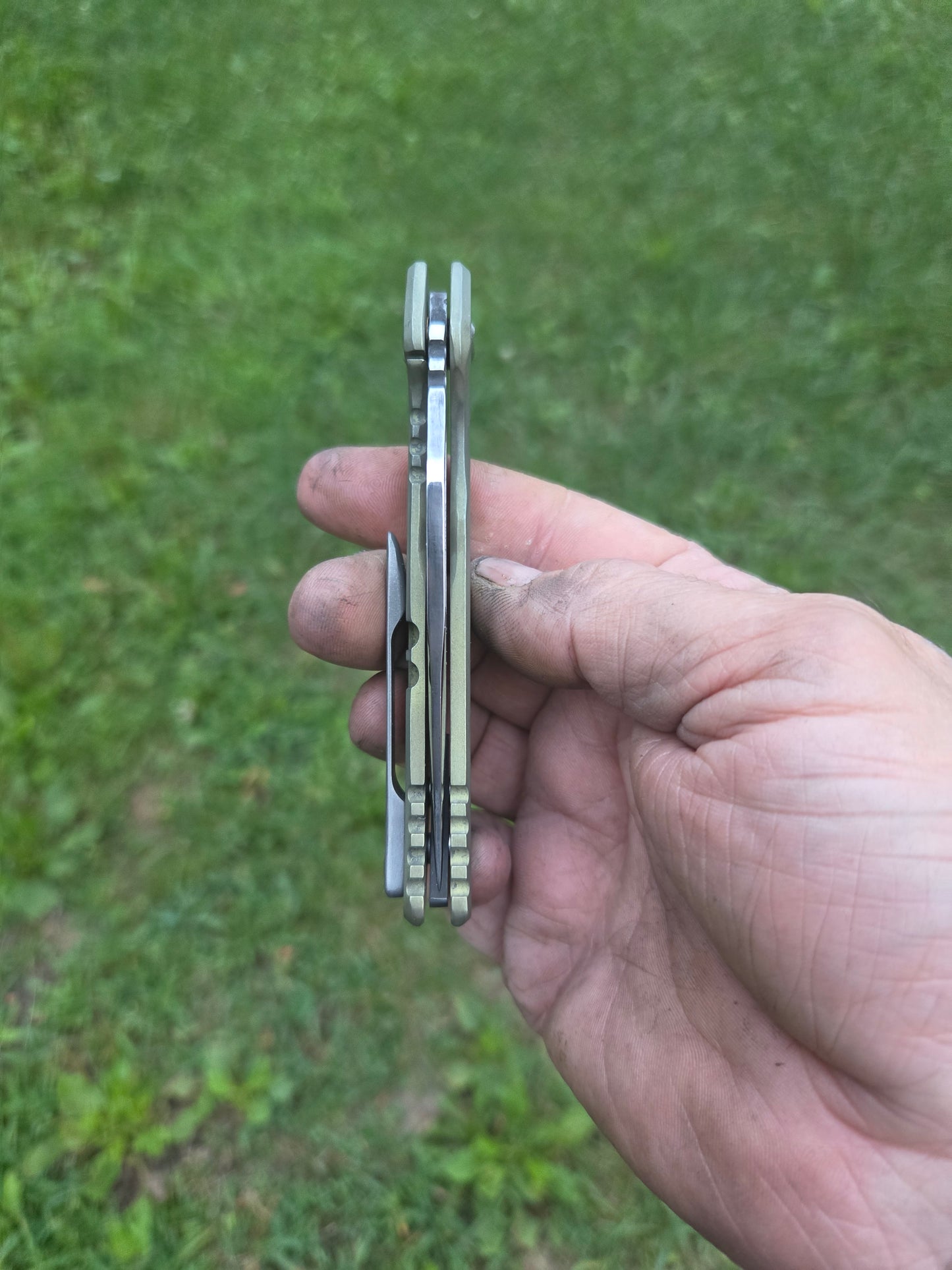 Green titanium frame lock