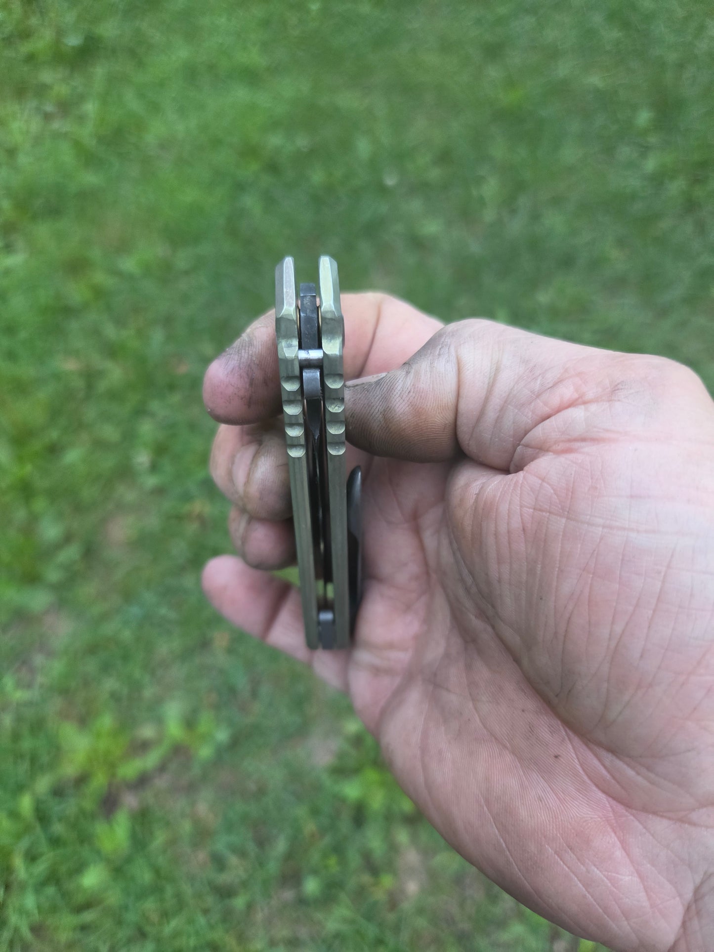 Green titanium frame lock